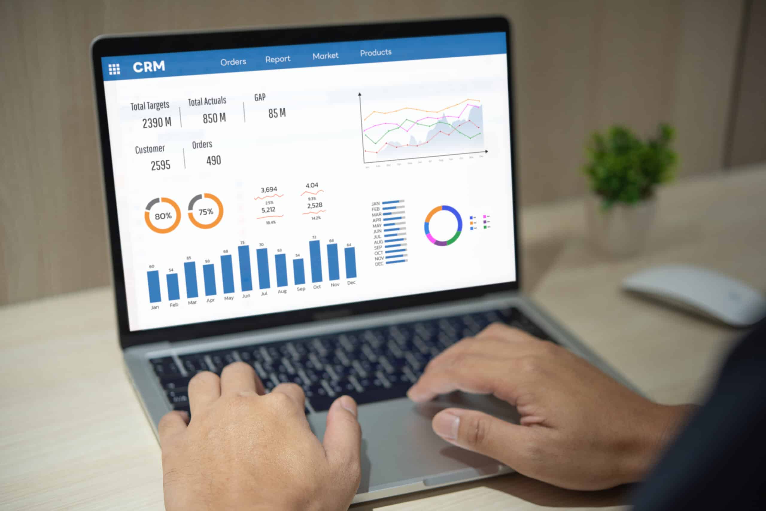 Marketer reviewing CRM data on screen while leveraging first party data in media campaigns